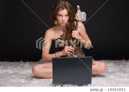 Closeup portrait of young savage woman with stone hammer and not 14421051
