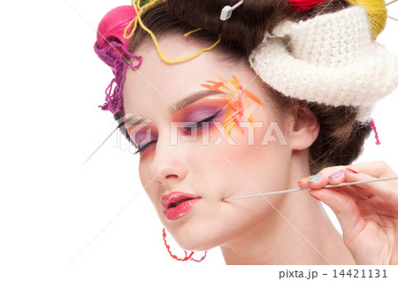 Closeup fashion woman with color face art in knitting style Closeup fashion woman with color face art in knitting style 14421131