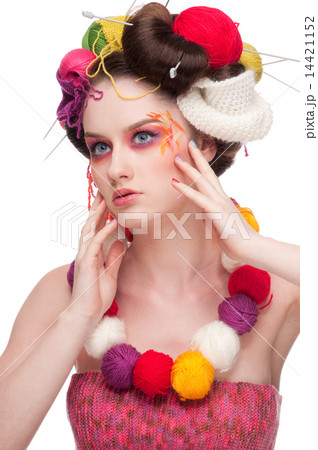 Closeup fashion woman with color face art in knitting style Closeup fashion woman with color face art in knitting style 14421152
