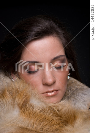 Close up portrait of young fashion woman in fur 14422883