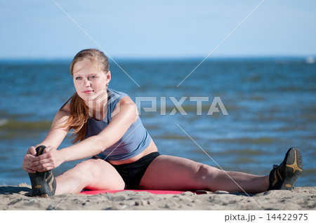 woman doing stretching exercise. Yoga 14422975