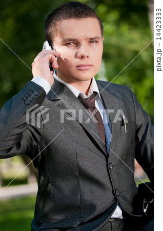 business man talk by mobile phone. Student 14423333