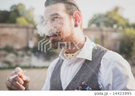 handsome big moustache hipster man smoking cigarette 14423995