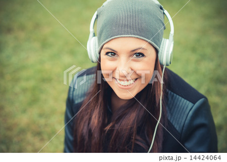 young beautiful brunette straight hair woman in the park 14424064
