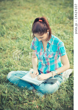 beautiful young hipster woman using laptop and tablet 14424107