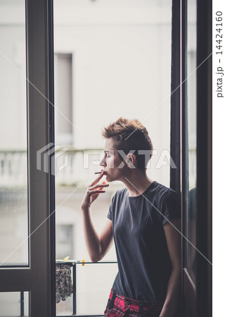 young lesbian stylish hair style woman smoking 14424160
