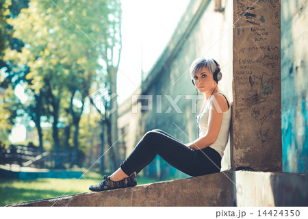 young beautiful short blue hair hipster woman with headphones mu young beautiful short blue hair hipster woman with headphones mu 14424350