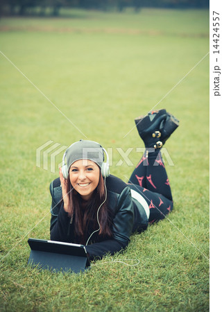 young beautiful brunette straight hair woman in the park 14424557