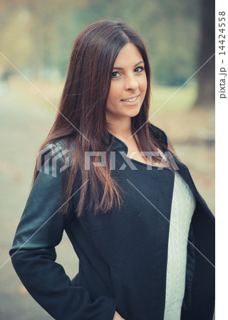 young beautiful brunette straight hair woman in the park 14424558