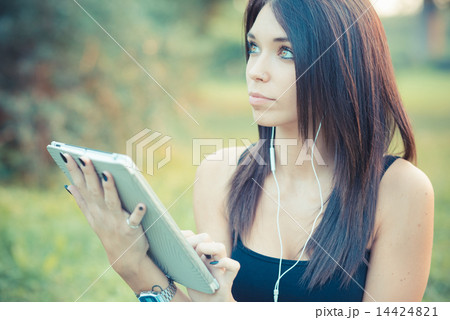 young beautiful brunette straight hair woman using tablet and sm 14424821