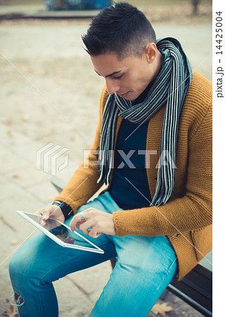 young handsome caucasian man in autumn park 14425004