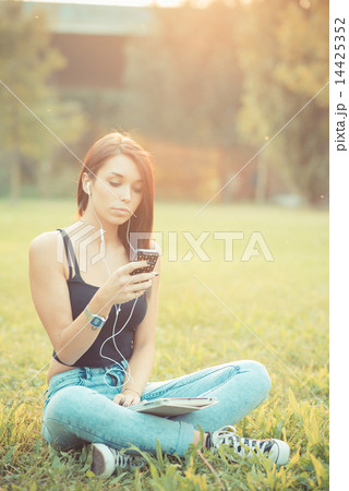 young beautiful brunette straight hair woman using tablet and sm 14425352