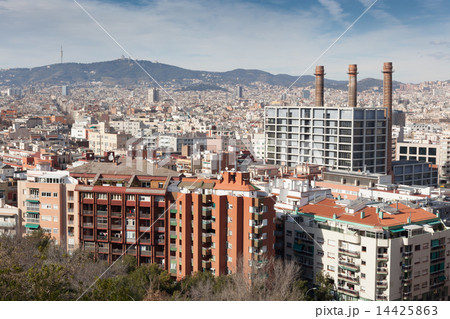 The chimneys of an old thermal power station in Parallel avenue seen from a terrace of Montjuic Hill, Barcelona, Catalonia, Spain 14425863