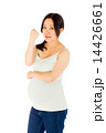 Pregnant asian woman isolated on white showing fist for strength 14426661