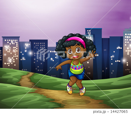 A young Black girl across the tall buildings in the city 14427065