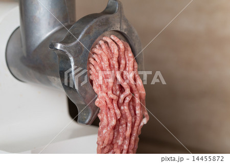 Mincer with fresh chopped meat 14455872