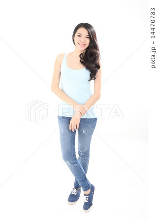 Woman in casual dress stand pose look forward 14470783