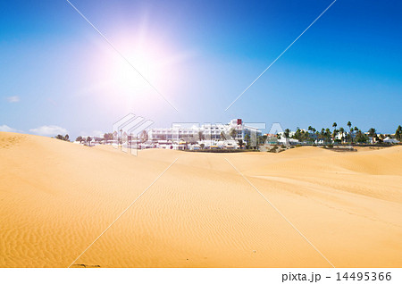 Sand dunes in sunny day. Beautiful white hotel Sand dunes in sunny day. Beautiful white hotel 14495366