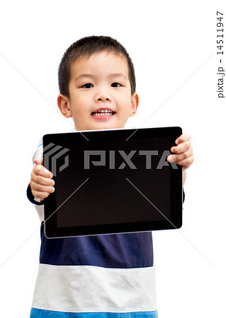 Little boy holding tablet with smiling face Little boy holding tablet with smiling face 14511947