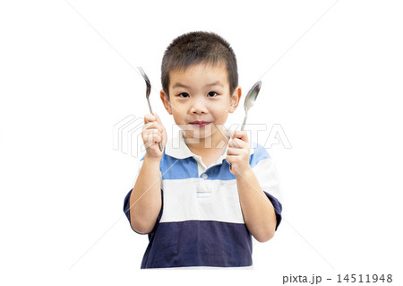 Little boy holding spoon and fork Little boy holding spoon and fork 14511948