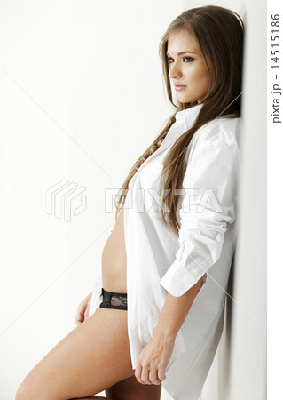 Woman in white open shirt 14515186