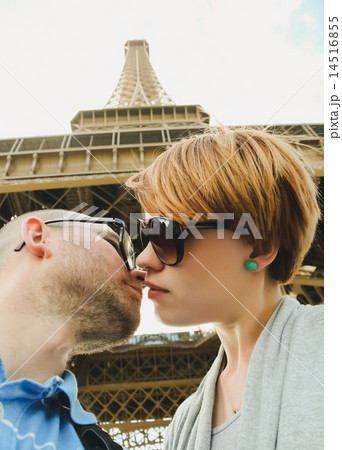 Young couple near the Eiffel Tower in Paris Young couple near the Eiffel Tower in Paris 14516855