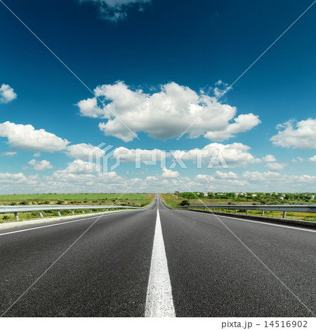 deep blue cloudy sky over asphalt road 14516902