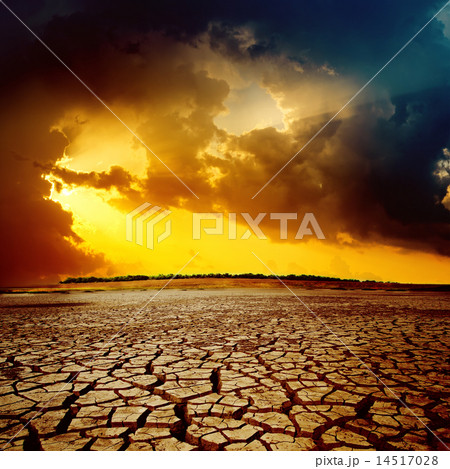sunset over cracked desert sunset over cracked desert 14517028