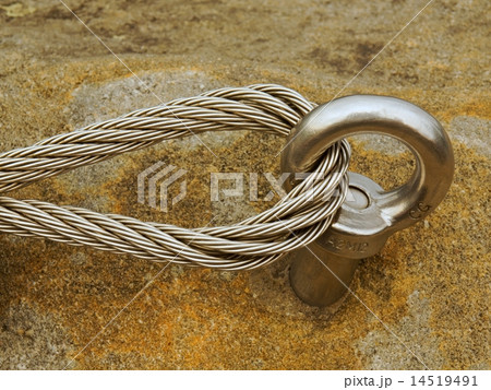 Detail of steel anchor eye and rope end in rock Detail of steel anchor eye and rope end in rock 14519491