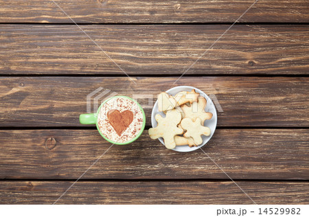 Cup of cappuccino with heart shape and cookies 14529982