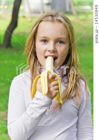Girl are eating banana 14530849