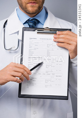 Doctor holding folder with form 14531341