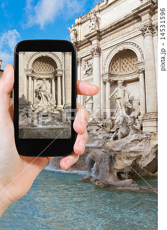 tourist taking photo of Trevi Fountain in Rome tourist taking photo of Trevi Fountain in Rome 14531596