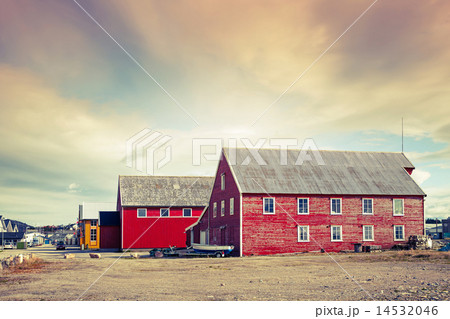 Red wooden fishing barns on the coast, Norway 14532046