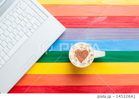 Cup of cappuccino with heart shape and computer Cup of cappuccino with heart shape and computer 14532641