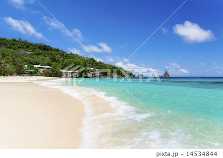 White coral beach sand and azure indian ocean. White coral beach sand and azure indian ocean. 14534844