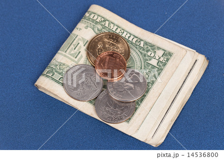 US coins on a blue notebook cover 14536800