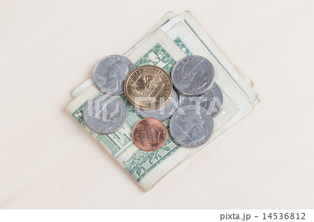 used US banknotes on wood table close up 14536812