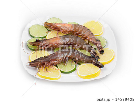 Raw shrimps on plate. 14539408