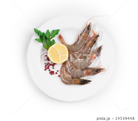 Raw shrimps on white plate. 14539448