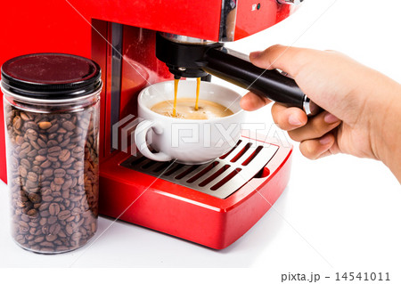 Brewing coffee with a red color coffee machine 14541011