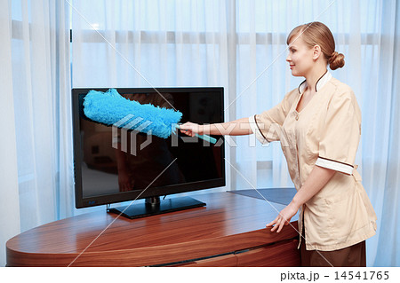 Hotel maid dusting furniture 14541765