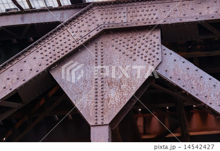 Industrial metal riveted girder joint bend Industrial metal riveted girder joint bend 14542427