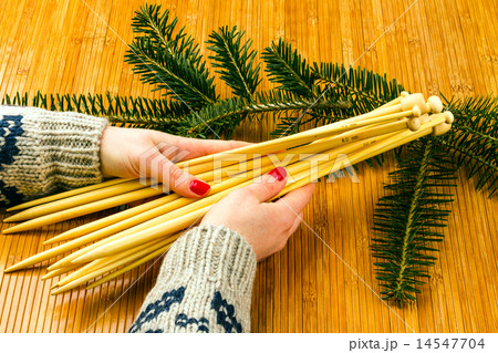 hands of the young woman holding knitting needles 14547704