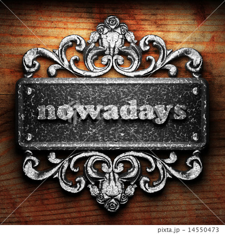 nowadays word of iron on wooden background nowadays word of iron on wooden background 14550473