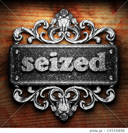 seized word of iron on wooden background seized word of iron on wooden background 14550896