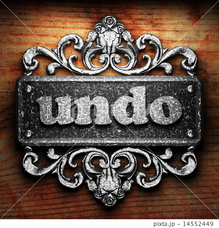 undo word of iron on wooden background 14552449