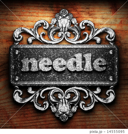 needle word of iron on wooden background 14555095