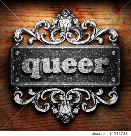 queer word of iron on wooden background 14555788