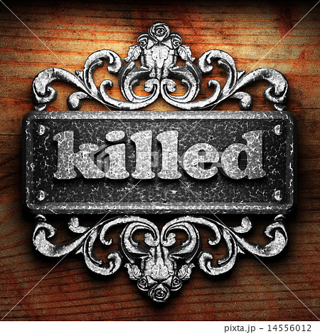 killed word of iron on wooden background 14556012